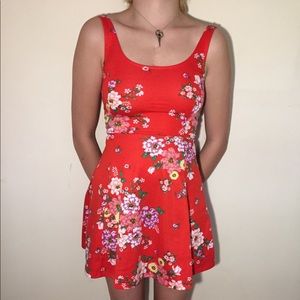 Red H&M Divided dress with floral pattern.